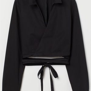 Black wrap crop top with waist detail.